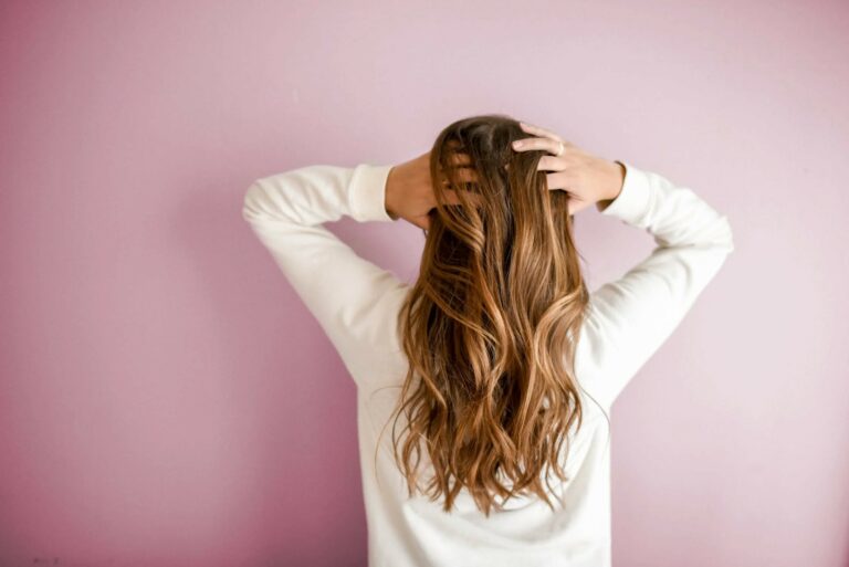 a woman touching her hair